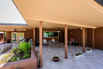 Outdoor patio area with seating and plants