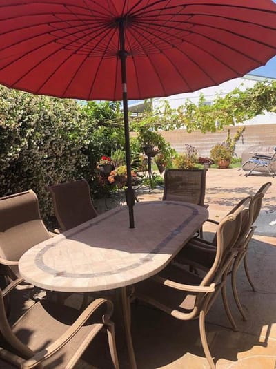 Outdoor dining area with a shaded table