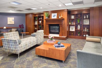 Cozy common area with seating and fireplace