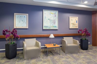 Cozy lobby area with seating and artwork