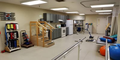 Therapy space with exercise equipment and appliances.