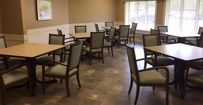 Dining area with tables and chairs.