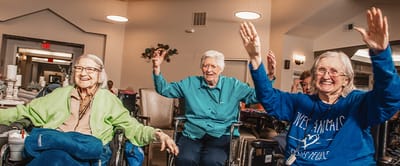 Residents enjoying a lively activity in a common area
