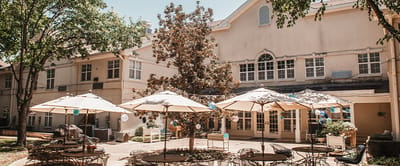 Outdoor patio area with seating and umbrellas