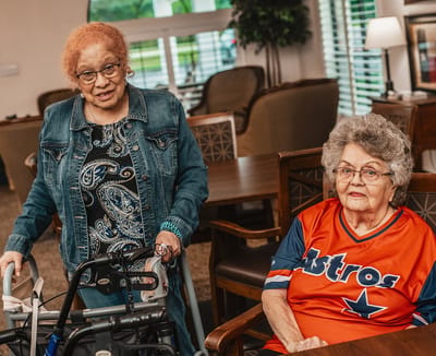 Two residents engaging in a communal space.