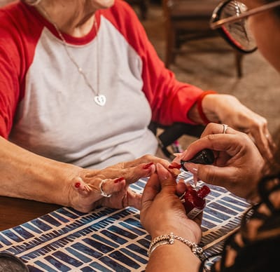 Residents enjoying a manicure activity together.