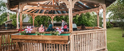 Outdoor gazebo with residents socializing