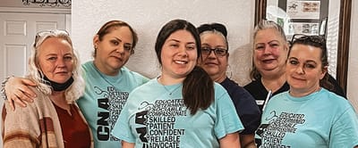 A group of staff members posing for a photo.