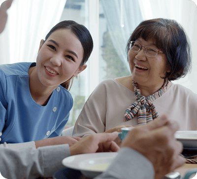 Staff member sharing a joyful moment with a resident