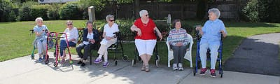 Residents enjoying time outside on a sunny day.