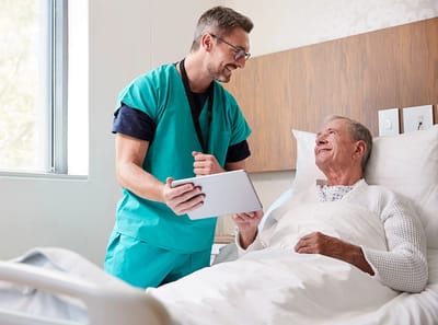 Healthcare worker engaging with senior resident