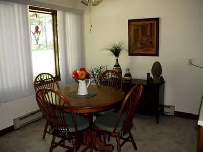 Cozy dining area with a table and chairs.
