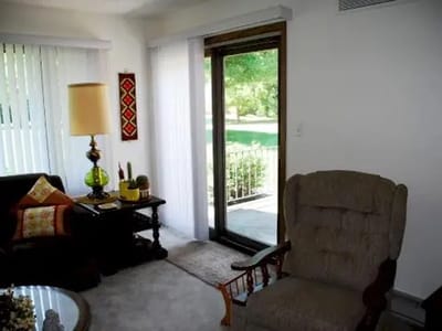 Cozy interior of a resident's room with comfortable furniture.