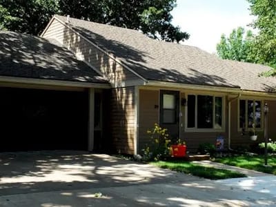 Exterior view of a residential building in sunlight.