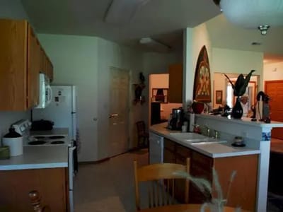 Interior kitchen area with cabinetry and appliances.