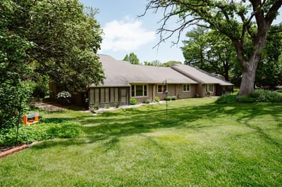 Exterior view of the facility surrounded by greenery.