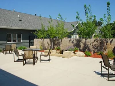 Outdoor space with seating and landscaping.