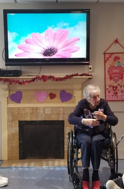 Resident enjoying a Valentine's Day event.