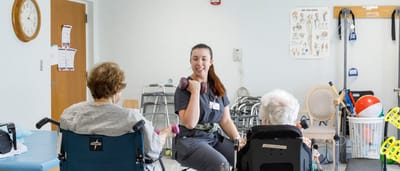 Therapy session with residents and staff.