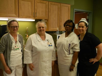 Staff members in the facility kitchen area