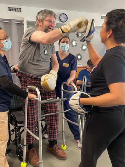 Staff and residents engaging in a physical activity