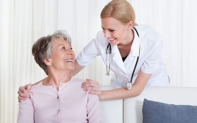 Happy interaction between a nurse and a resident.