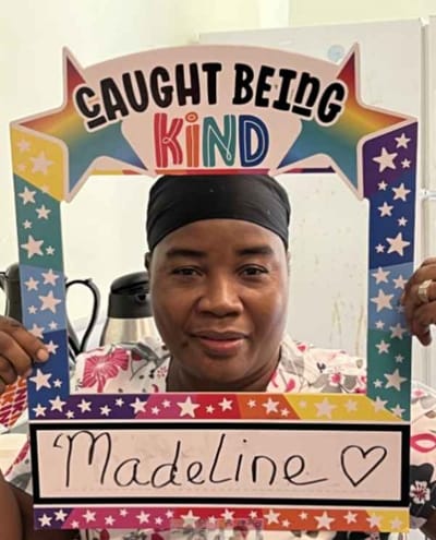 Resident celebrating kindness with a colorful frame.