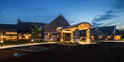 Exterior view of WellBridge of Novi at dusk.
