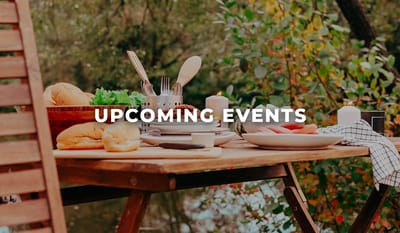 Outdoor dining setup with food and utensils