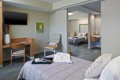 Private resident room with beds and furniture