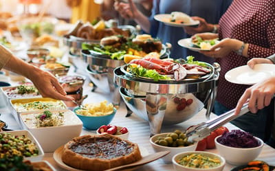A communal dining event with various dishes.