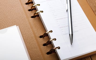 Close-up of a planner and pen.