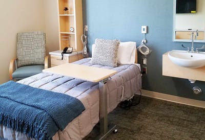 Cozy resident room with bed and seating area