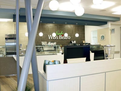 Interior view of a dining area with a café setup.