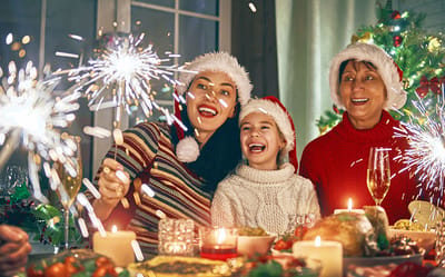 Families celebrating with sparklers during the holidays