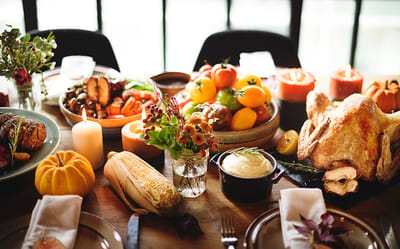 A festive dining table with seasonal food decorations.