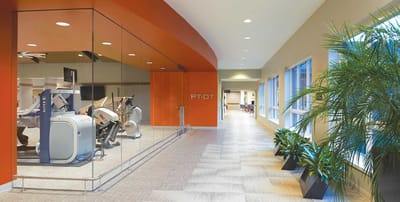 Interior view of a therapy gym with equipment