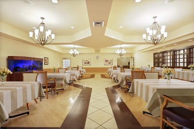 Bright dining room with tables and decorations.