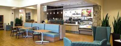 Interior dining area with seating and café counter.