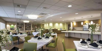 Contemporary dining room with elegant table settings.