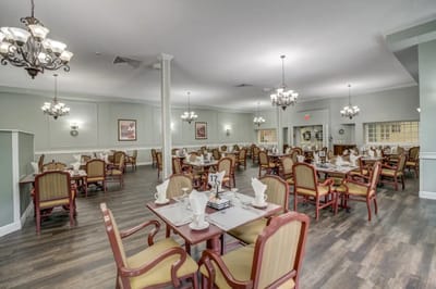 Dining area with neatly set tables and chairs