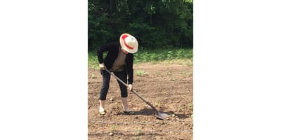 Resident gardening in an outdoor space