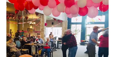 Residents enjoying a dance party in a common area