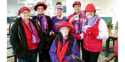 Residents dressed in festive colors celebrating together