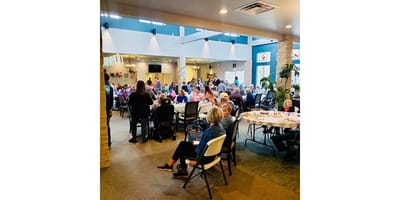 Residents enjoying a group meal in the dining area