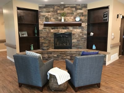 Cozy common area with seating and fireplace.