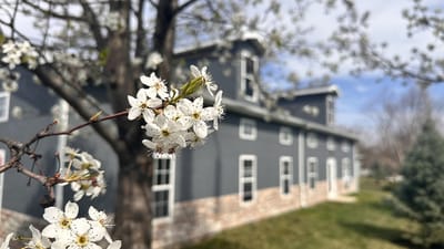 Exterior view of the facility with blooming flowers
