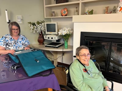 A staff member assisting a resident in a care facility