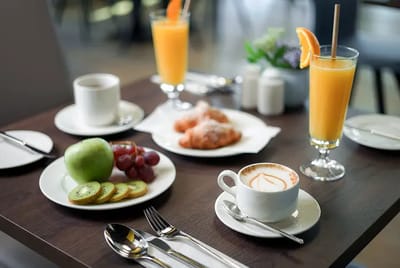 Breakfast setup with fresh fruits and beverages