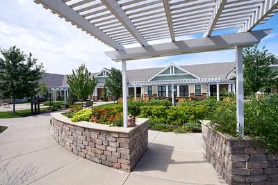 Outdoor garden area with seating and flowers